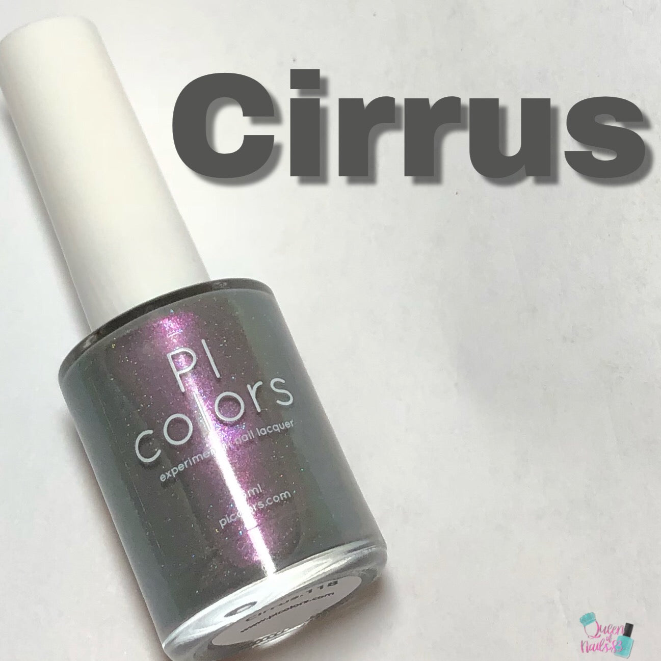 A bottle of PI Colors nail polish, labeled with the shade "Cirrus.118 Pink Gray Nail Polish," is displayed against a light background. This gray-based polish with a subtle pink shimmer has the word "Cirrus" prominently featured above it, emphasizing its 10-free formula.