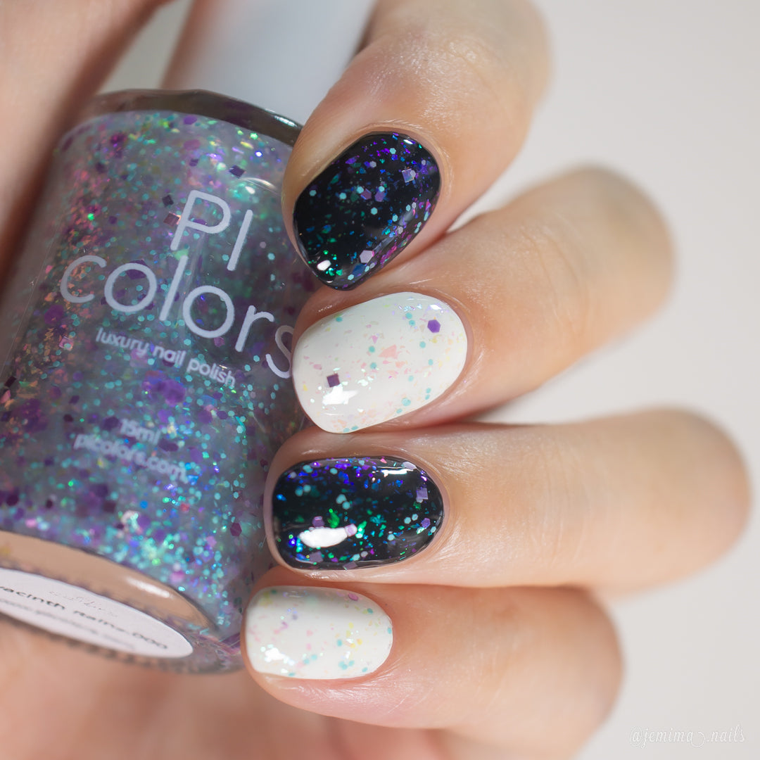 A hand holds a bottle of PI Colors' "Hyacinth Rains.000" luxury nail polish, showcasing a vibrant display of style. The nails are adorned with black and white polish, enhanced by iridescent glittery accents. This 10-free formulation gleams with colorshifting rainbow flakies in a dark purple base, making it an ideal nail polish topper.