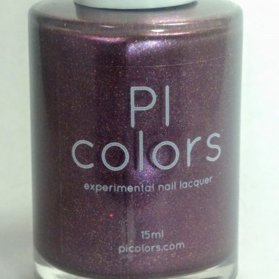 A bottle of Cœur.005 Purple Nail Polish by PI Colors features a shimmering purple shade, evoking the look of glitter nail polish. The label states: "PI Colors, experimental handmade nail polish, 15ml, picolors.com.