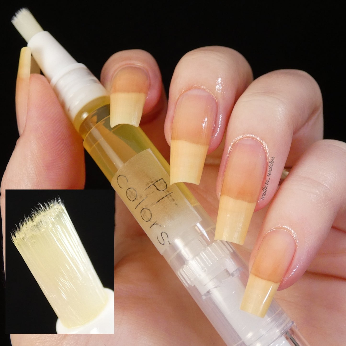 A hand with long, yellow-tinted nails is holding a clear tube with a brush applicator on one end, containing a yellow liquid labeled "PI Colors." This product, named Honey Scented Cuticle Oil, is enriched with jojoba oil. An inset image provides a close-up of the brush applicator tip.