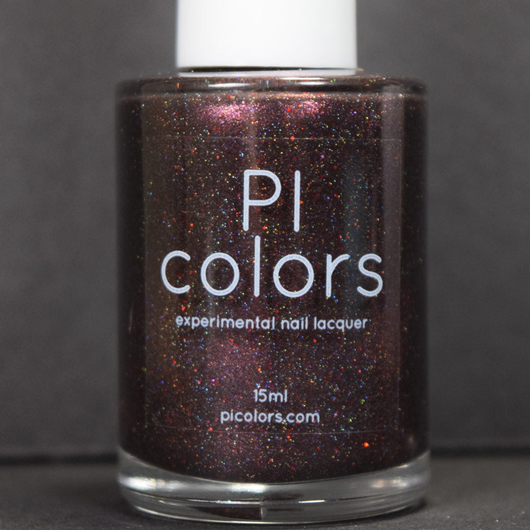 A bottle of PI Colors' "Ursidae.072 Red Black Nail Polish" showcases a captivating 15ml mix of black nail polish speckled with glittery red and purple flecks. This 10-free formula provides a striking contrast against a plain dark surface, highlighting its bold allure.