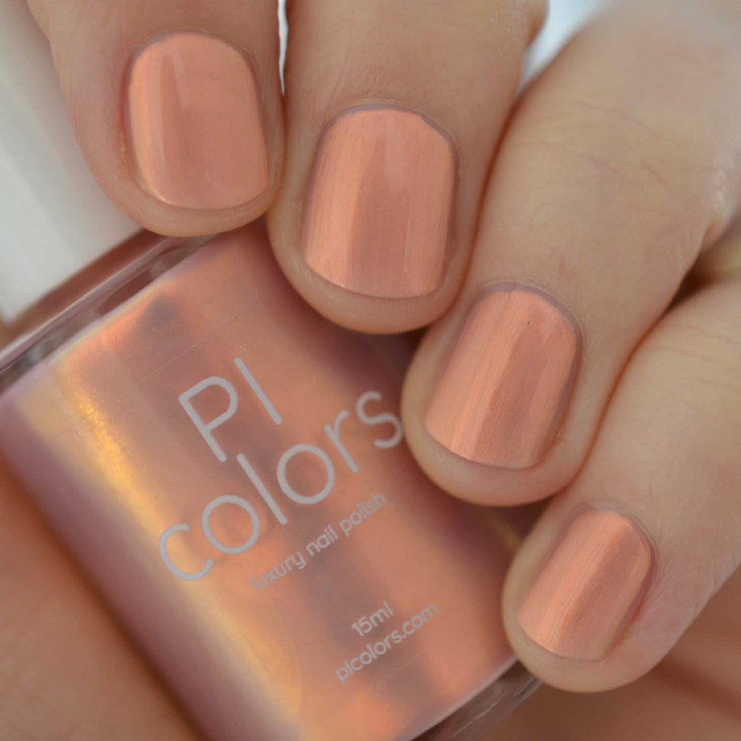 Hand with pink gradient nail polish