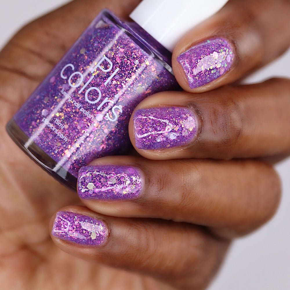 Purple nail polish with iridescent rainbow flakies and holo glitter by PI Colors
