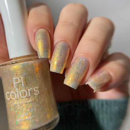 Nail polish with glittery finish held by a hand, brand 'PI colors' visible