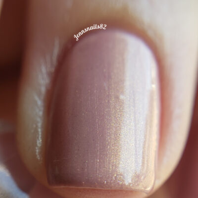 Close-up of a fingernail painted with PI Colors' luxurious handmade Milk Berry.073 Pink Nail Polish, featuring a smooth and glossy texture.