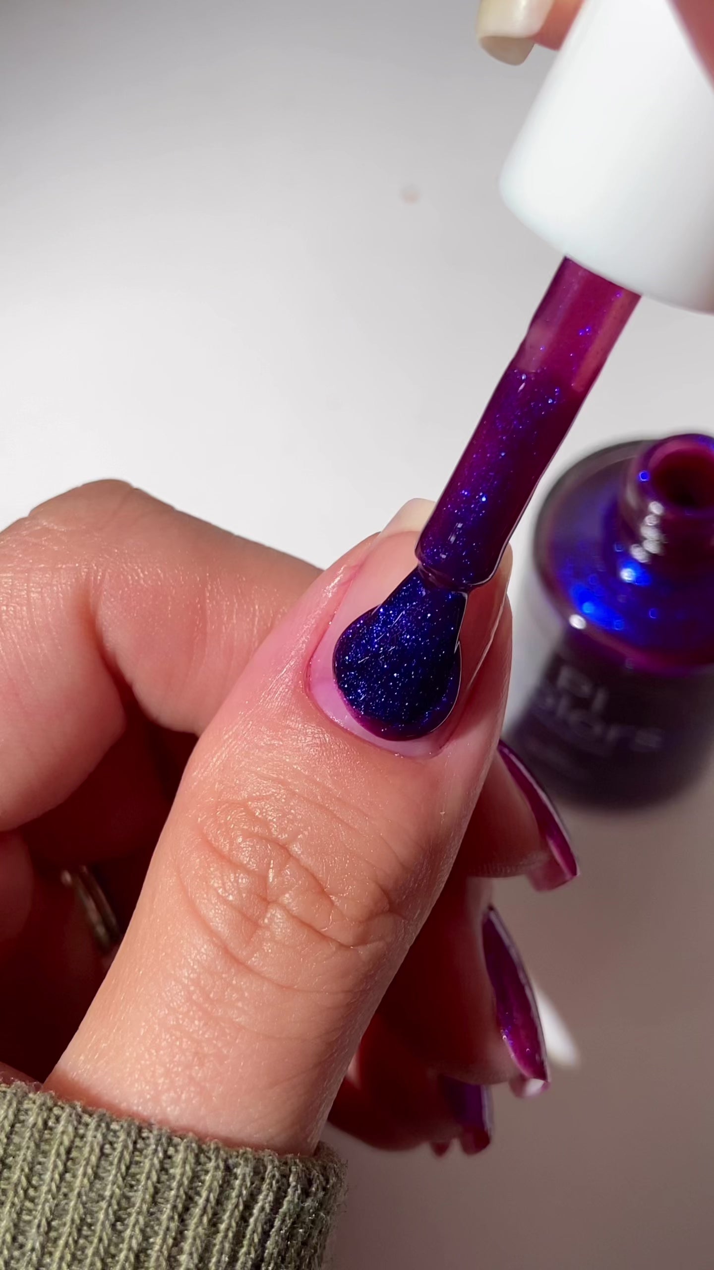video of purple nail polish applied to natural nail
