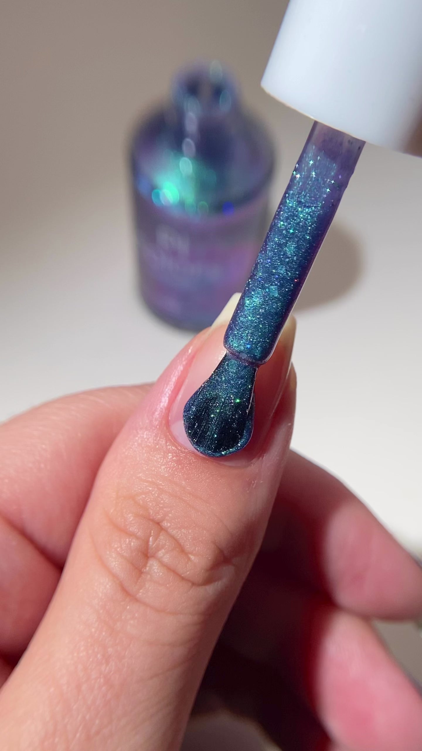 PI Colors glittery blue green nail polish