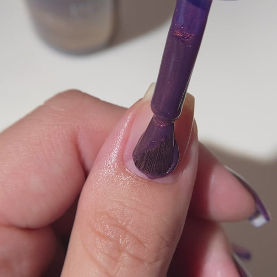 purple nail polish application