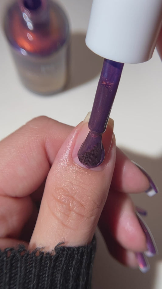 purple nail polish application